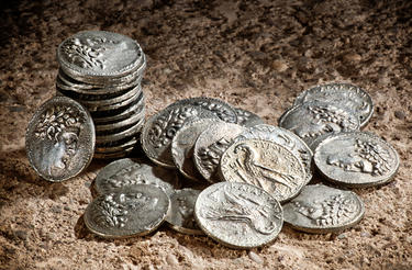 Old coins representing 30 pieces of silver.