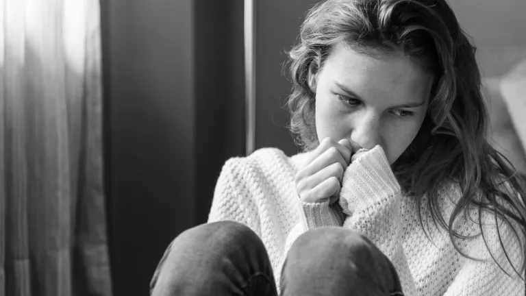 It was time to anchor myself in Christ and my loving Father, and let Him be the safe harbor of my life. Christ understands shame and betrayal because He lived through this. A sad woman sitting on the floor.