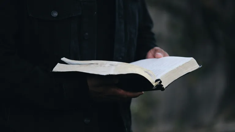 No other religion compares to the true covenant relationship God offers—marked by His astounding mercy, eternal promises, and the selfless sacrifice of Jesus Christ for those who choose to follow Him. A man holding an open Bible.