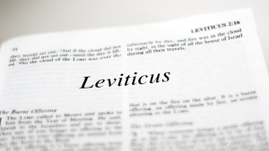 A Bible opened to the beginning of the book of Leviticus.