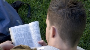 A man reading a Bible.