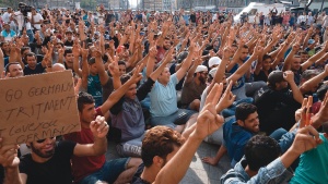 Young Syrian males strike at a Hungarian railway station demanding transit to Germany in late 2015.