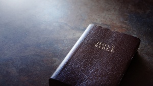 A Bible laying on a table.