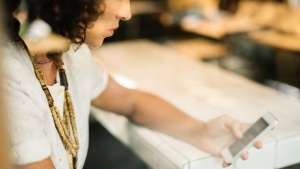 A woman looking at her smartphone.