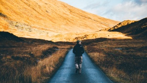 A man walking on a path.