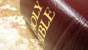 Bible laying on top of a table