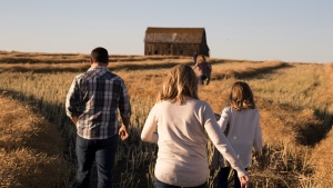 A family walking through a field.