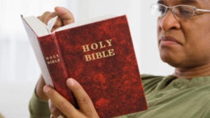 Man reading the Bible.