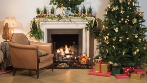 A Christmas tree in a festively decorated living room.