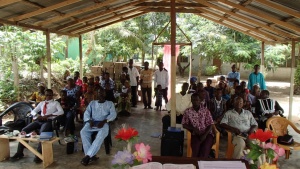 Brethen in Kwanyako, Ghana at the current meeting location. Located under low power lines, this open air structure has been condemned by the local government.