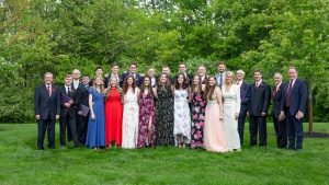 The ABC class of 2021 and faculty members smile after commencement