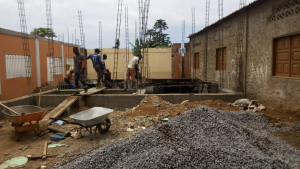 Photo of workers building the expansion of the school.