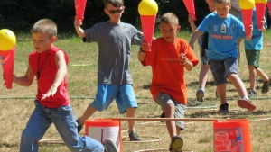 Campers enjoying novelty olympic games. 