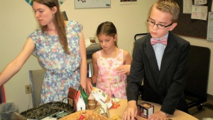 Youth from the Charlotte, North, Carolina congregation work hard at filling gift baskets for local shut ins. These baskets were delivered before the Feast. 