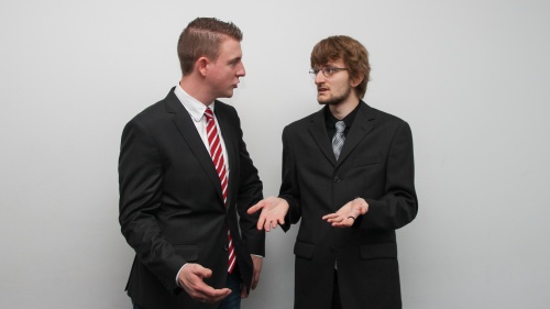 two men in suits in conversation