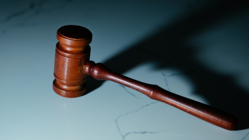 a gavel on a marble surface