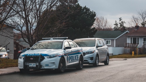 Police car outside of house.