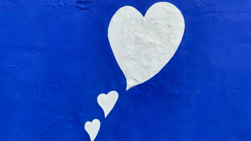 White Hearts on Blue Background