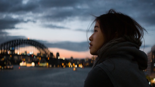 A woman looking up at the sky.