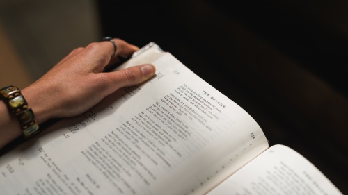 A woman reading a Bible.