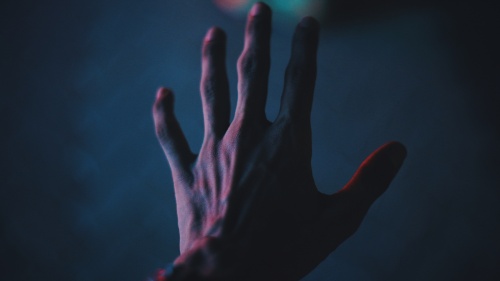 A hand reaching.