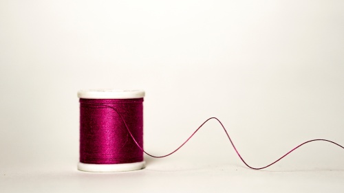 A spool of thread unraveling.