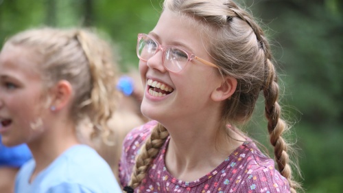 a smiling preteen girl