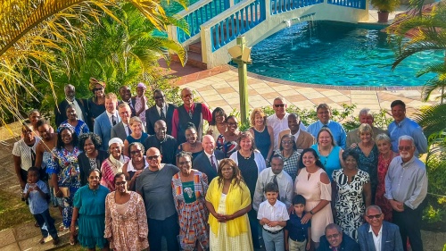 a group of people seen from above with a resort background