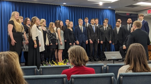 a choir standing onstage