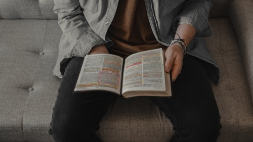 A man reading a Bible.