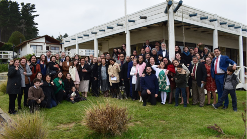 a large group of people standing outside a building