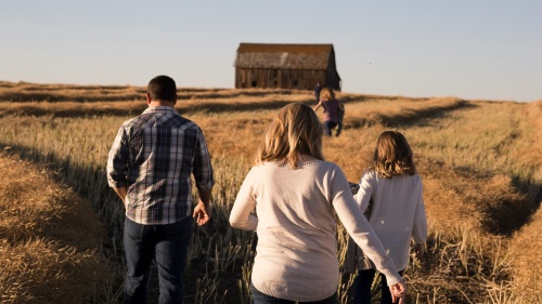 A family walking through a field.