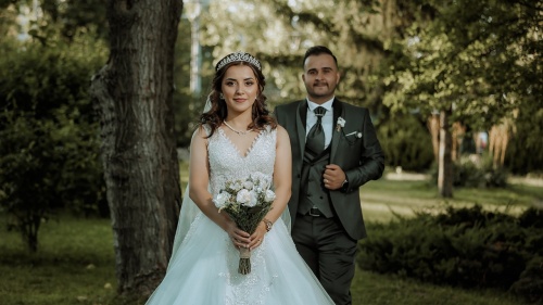 a bride and a groom walking outside