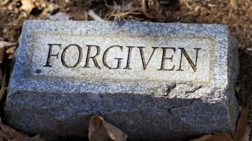 &quot;Forgiven&quot; engraved on a tombstone.