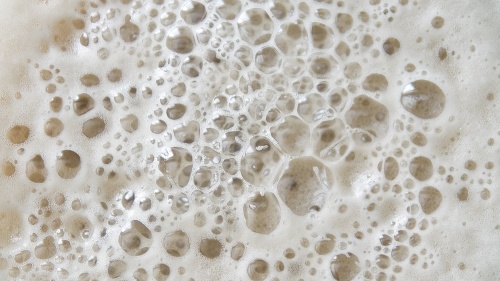 Bubbles on the top of liquid.