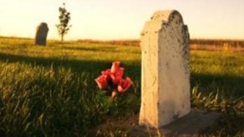 Grave with flowers at sunset - Understanding God&#039;s Word: The Resurrections of th