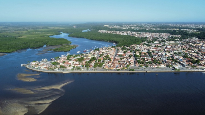 a city peninsula touching the water as viewed from above