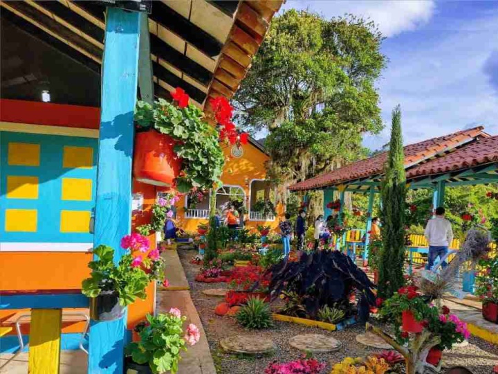 a colorful city street with brightly painted buildings