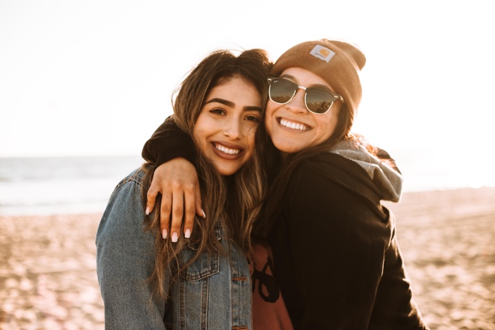 two young women standing outdoors