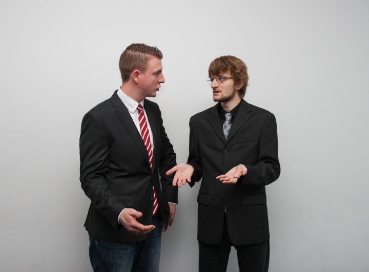 two men in suits in conversation
