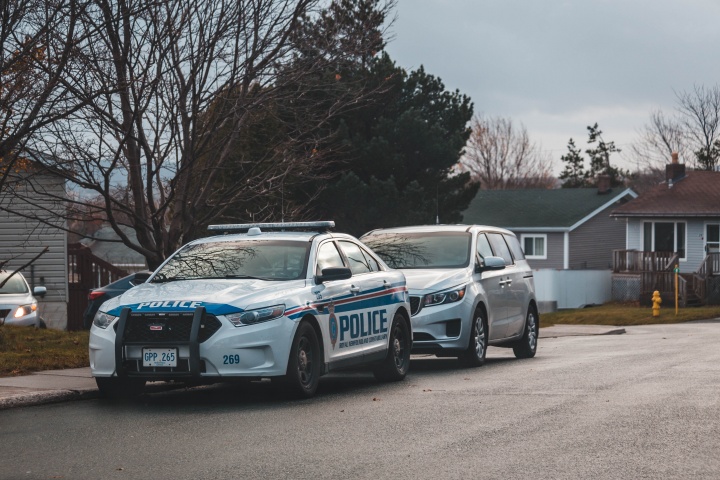 Police car outside of house.