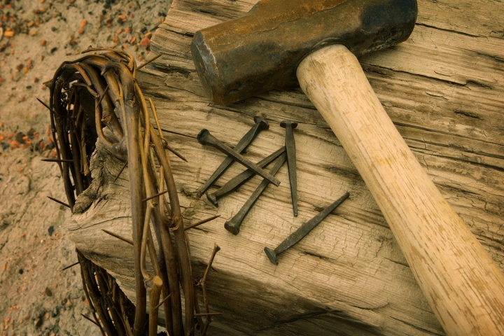 An reenactment of the items used in Jesus Christ cruxifixion - crown of thorns, nails, hammer and stake.