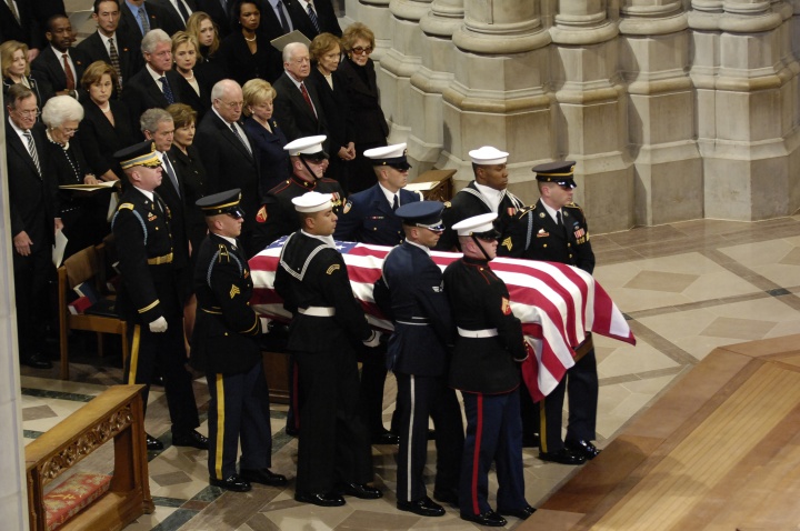The casket of President Gerald R. Ford is carried past a group that includes President George W. Bush, first lady Laura Bush and Presidents George Bush Sr., Bill Clinton and Jimmy Carter at the National Cathedral in Washington Jan 2, 2007. 