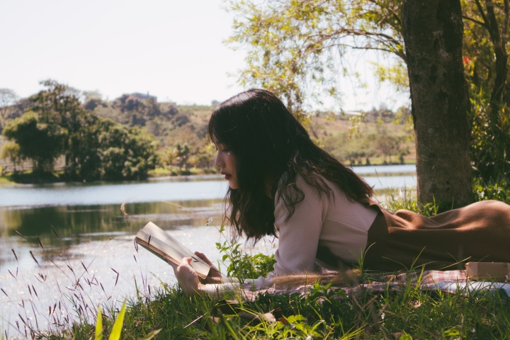 A woman reading a book.