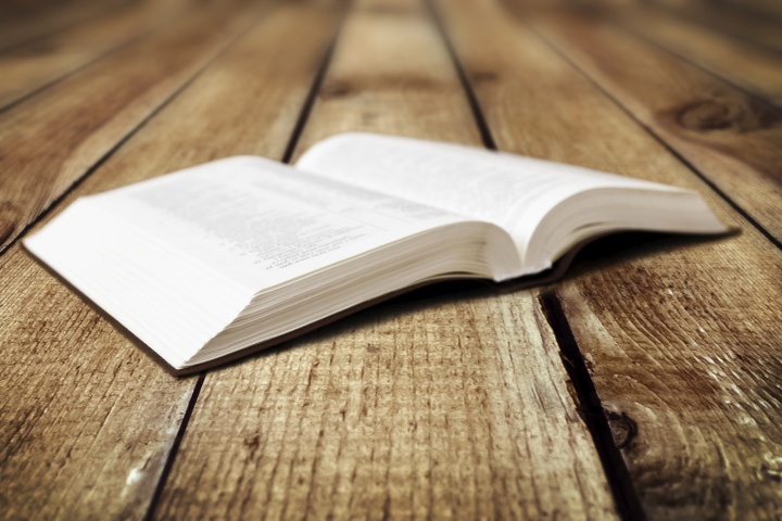 A open Bible on a table.