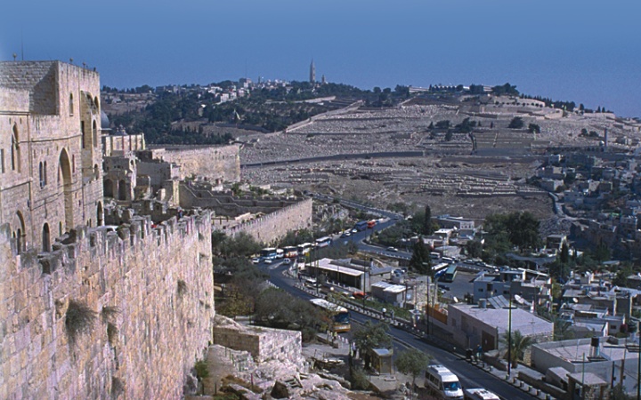 The prophet Zechariah describes how Jesus will return to the Mount of Olives (background, above), which overlooks Jerusalem (foreground) on the city’s east side.