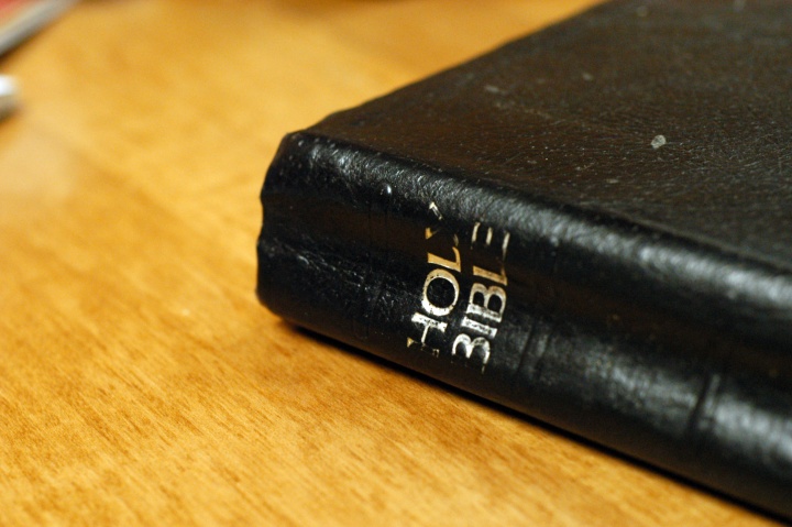 Bible laying on top of a table