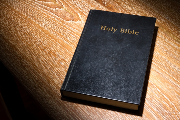 A Bible laying on a table.