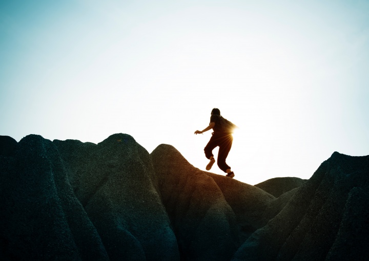 A person running up a mountain.