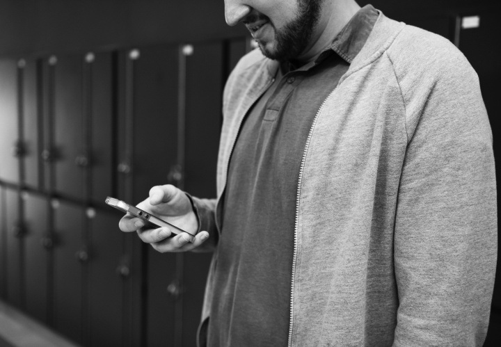 A man looking at his smartphone.